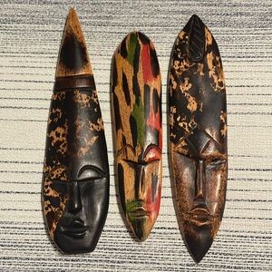 3 small African Wood Carved Masks-2 are black, brown & tan colored.